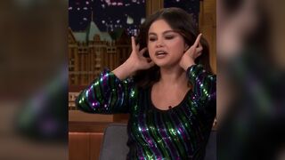 Selena Gomez doing things with her hair