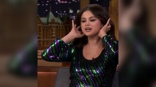 Selena Gomez putting her hair up before giving you a sloppy blowjob