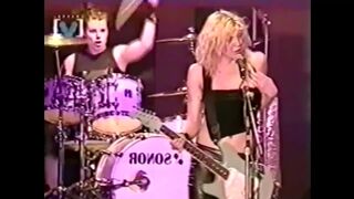 Courtney Love showing her tits to thousands of fans during a concert