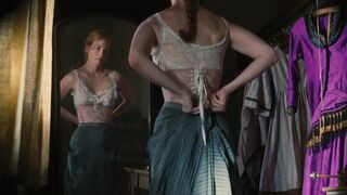 January Jones undresses, displays marvelous breasts