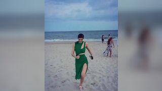 Alexandra Daddario running on the beach